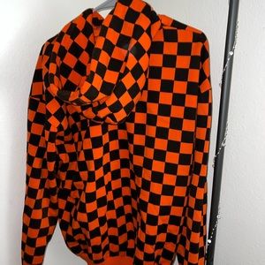 Orangish- red, checkered hoodie. Size Large. Unisex.